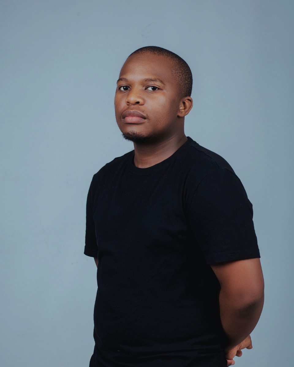 A young black man in a black t-shirt.